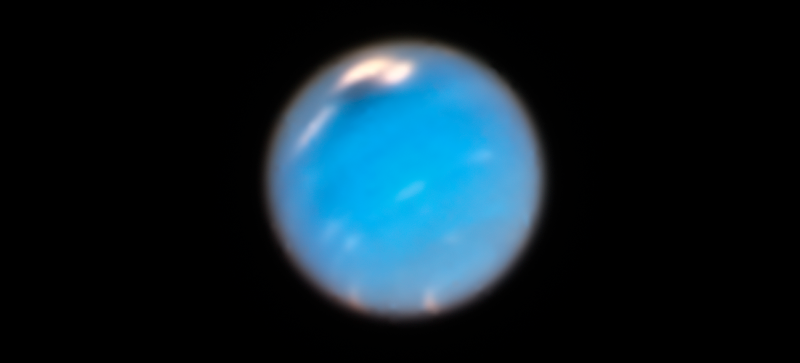 Neptune, with the dark vortex at top center.